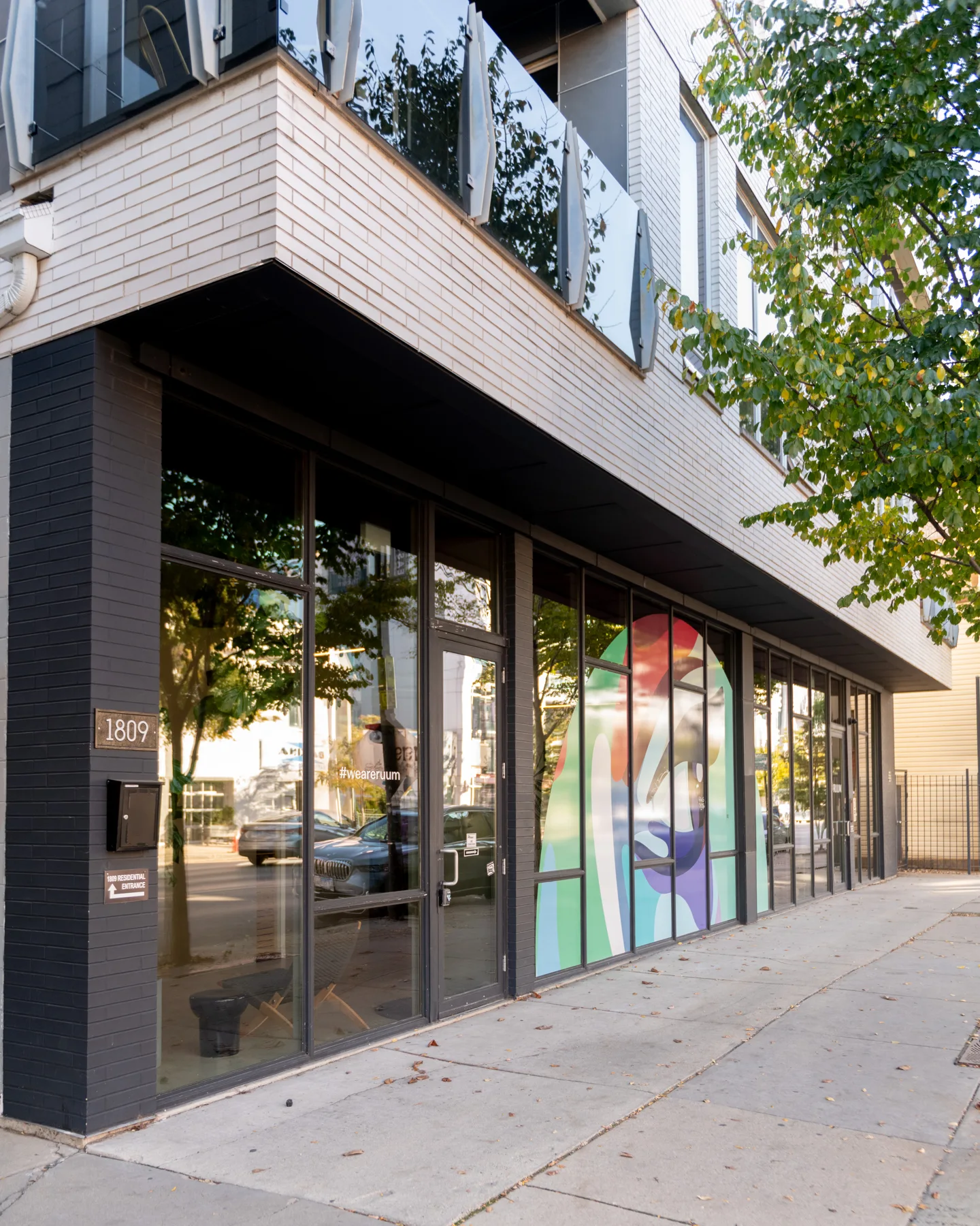 Glass storefront of the Good Beauty building on Chicago Avenue